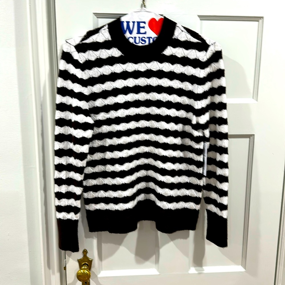 Brown and  white ladies sweater. Very comfortable.